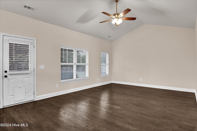 interior space featuring vaulted ceiling, ceiling fan, and dark wood-type flooring