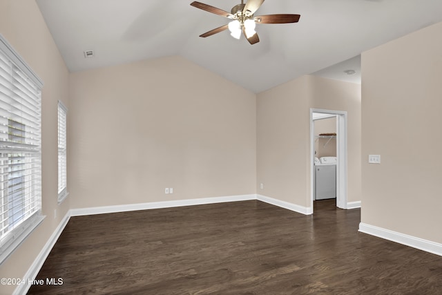 unfurnished room with washing machine and clothes dryer, ceiling fan, dark hardwood / wood-style flooring, and vaulted ceiling