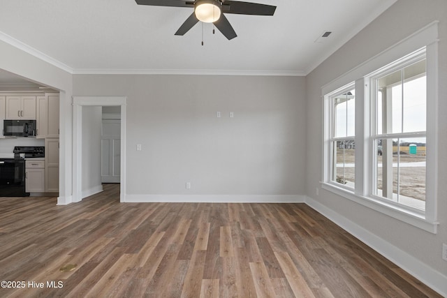 unfurnished living room with wood finished floors, visible vents, and crown molding