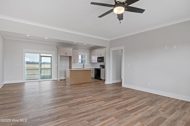 unfurnished living room with light wood finished floors and baseboards