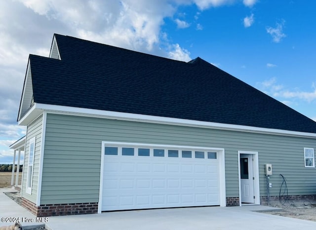 exterior space featuring a garage and driveway