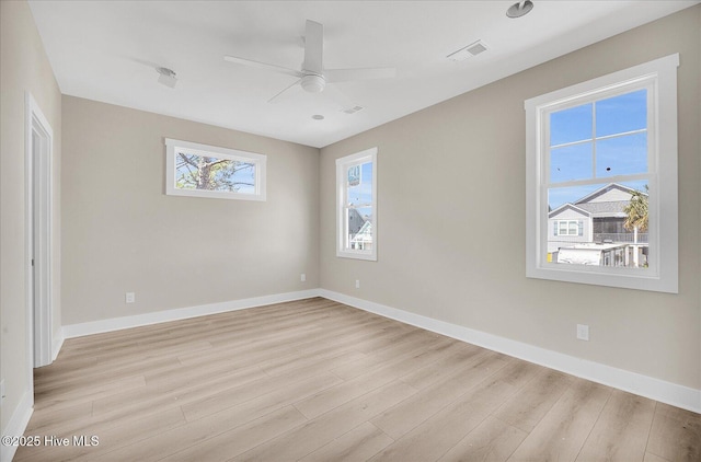 820 Kenneth Ave Unit 1, Carolina Beach, NC 28428 - unfurnished room featuring baseboards, a ceiling fan, light wood-type flooring, and visible vents