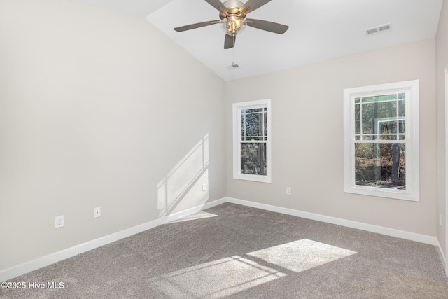 unfurnished room with carpet floors, vaulted ceiling, and ceiling fan