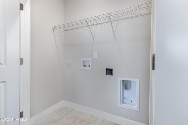 clothes washing area with electric dryer hookup, light tile patterned floors, hookup for a washing machine, and gas dryer hookup