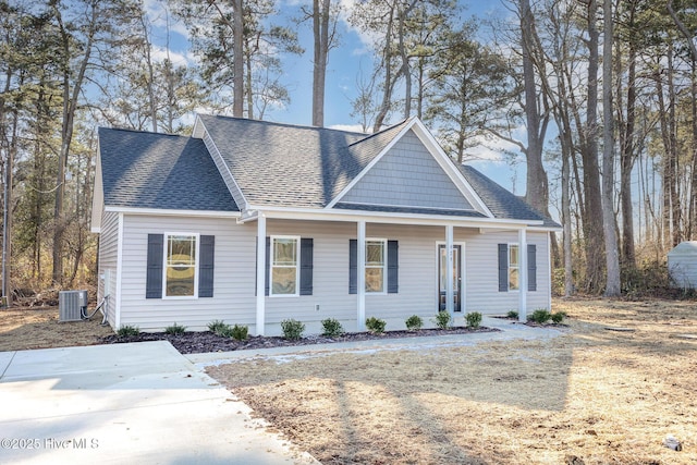 view of front facade featuring cooling unit and covered porch