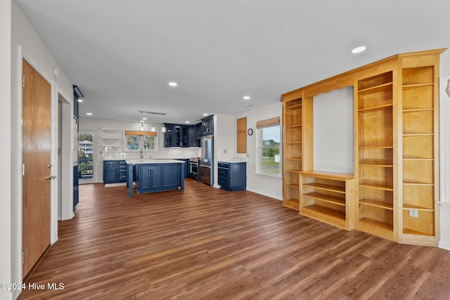 unfurnished living room featuring dark wood-type flooring