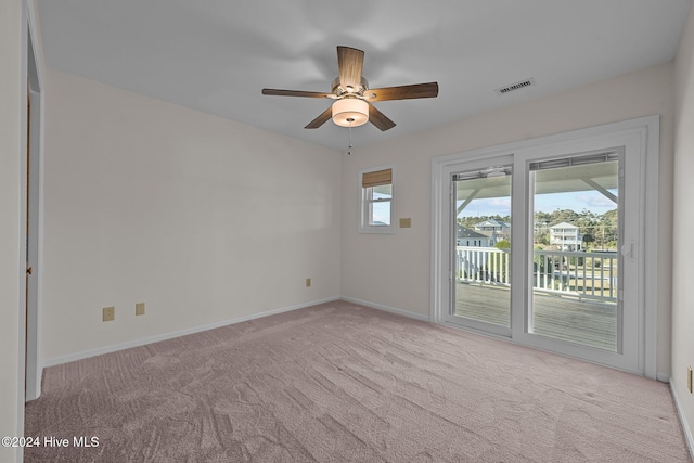 carpeted empty room with ceiling fan