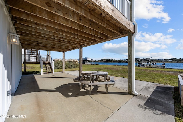 view of patio with a water view