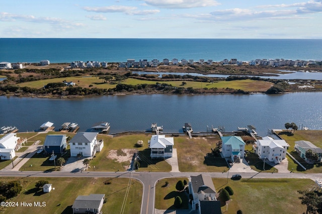 birds eye view of property with a water view