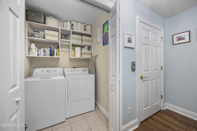 209 Hillside Dr N Unit 201, North Myrtle Beach, SC 29582 - washroom with washer and clothes dryer and baseboards