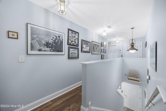 209 Hillside Dr N Unit 201, North Myrtle Beach, SC 29582 - corridor featuring an upstairs landing and dark wood-type flooring