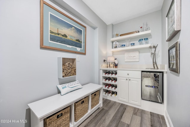 209 Hillside Dr N Unit 201, North Myrtle Beach, SC 29582 - indoor dry bar with light wood-style flooring and wine cooler