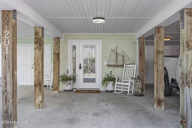 209 Hillside Dr N Unit 201, North Myrtle Beach, SC 29582 - view of exterior entry featuring a porch