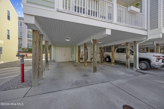 209 Hillside Dr N Unit 201, North Myrtle Beach, SC 29582 - view of vehicle parking with a carport