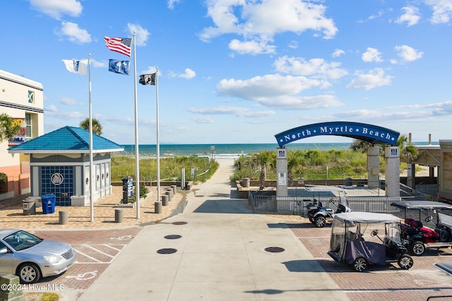 209 Hillside Dr N Unit 201, North Myrtle Beach, SC 29582 - view of property's community featuring uncovered parking and view of water and beach