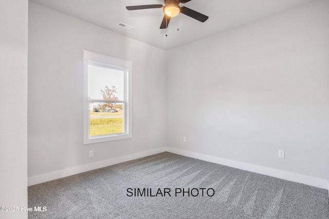 empty room with ceiling fan and carpet flooring