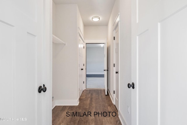 corridor featuring dark hardwood / wood-style floors