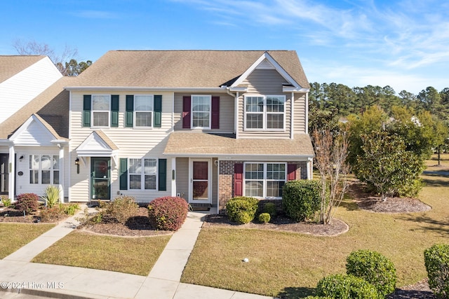 view of front of house featuring a front lawn