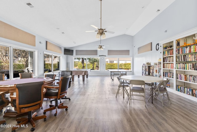 dining space with ceiling fan, plenty of natural light, hardwood / wood-style floors, and billiards