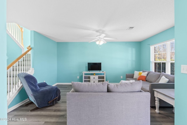 living room with hardwood / wood-style flooring and ceiling fan