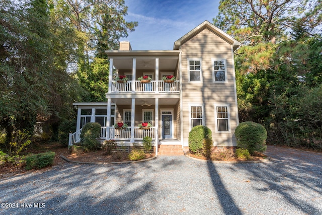 view of front of property with ceiling fan and a porch