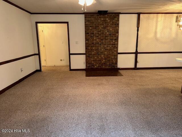 1738 NC-306 Hwy S, Grantsboro, NC 28529 - carpeted spare room featuring baseboards and ornamental molding