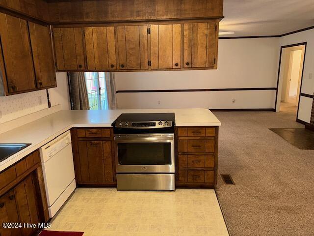 1738 NC-306 Hwy S, Grantsboro, NC 28529 - kitchen featuring electric range, white dishwasher, light countertops, and a peninsula