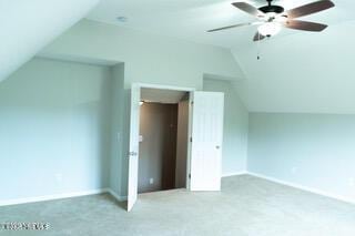 additional living space with ceiling fan and vaulted ceiling