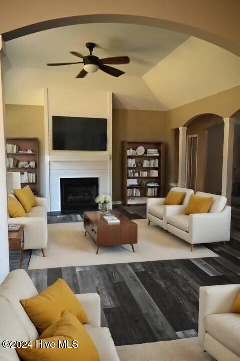 living room featuring ceiling fan and wood-type flooring