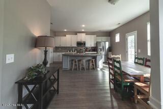 dining space with dark hardwood / wood-style floors