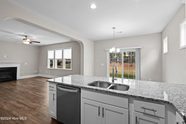 kitchen with a wealth of natural light, dishwasher, and sink