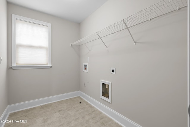 clothes washing area featuring hookup for a washing machine and hookup for an electric dryer