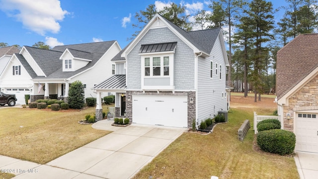 view of front of property featuring a garage and a front yard