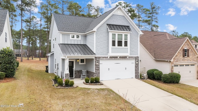 view of front facade with a front yard and a garage