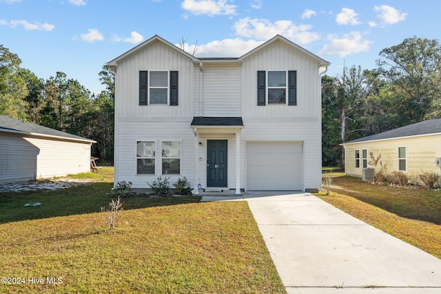 view of front of property with central AC unit, a front yard, and a garage