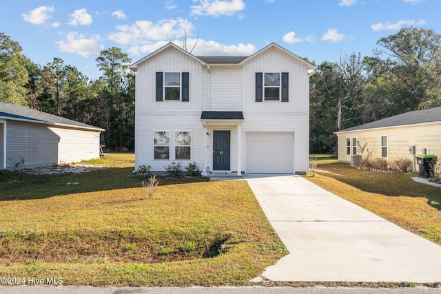 view of front of property with cooling unit, a garage, and a front yard