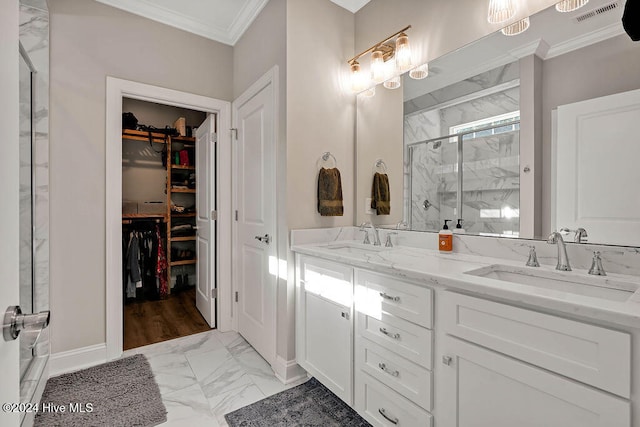 bathroom with crown molding, a shower with door, and vanity