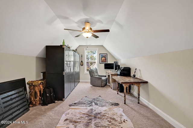 carpeted office with ceiling fan and lofted ceiling