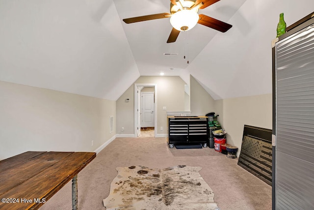 bonus room featuring ceiling fan, light carpet, and vaulted ceiling