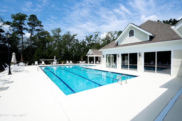 view of pool with a patio area