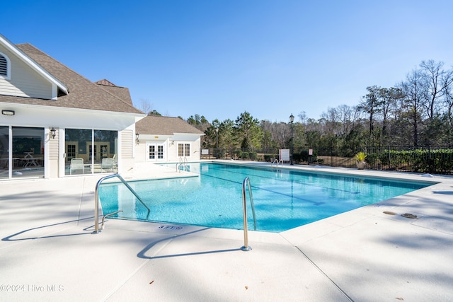 view of swimming pool with a patio