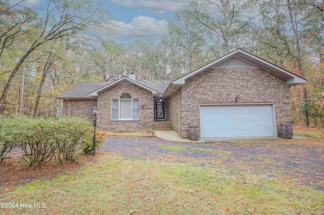 ranch-style home featuring a garage