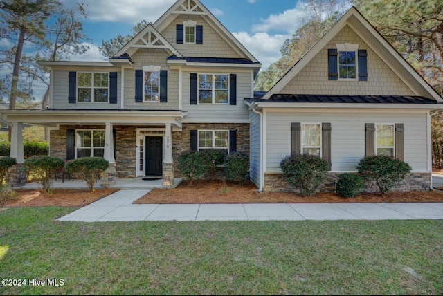 270 Hydrangea Ln, Hampstead, NC 28443 - craftsman-style home featuring a standing seam roof, metal roof, and a front lawn