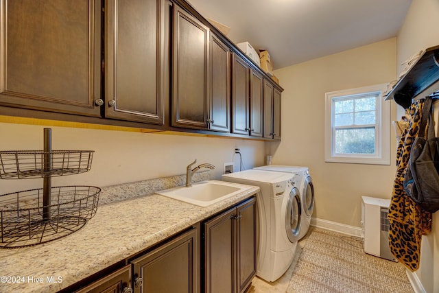 270 Hydrangea Ln, Hampstead, NC 28443 - laundry area with cabinet space, washing machine and clothes dryer, baseboards, and light tile patterned floors