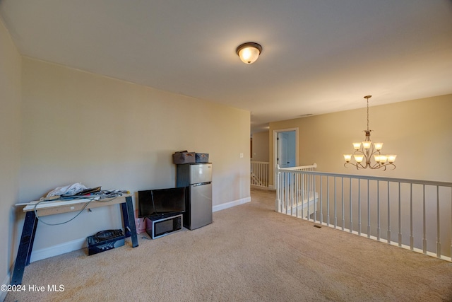 270 Hydrangea Ln, Hampstead, NC 28443 - spare room with carpet floors, a chandelier, and baseboards