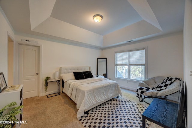 270 Hydrangea Ln, Hampstead, NC 28443 - bedroom with a raised ceiling, light carpet, and baseboards