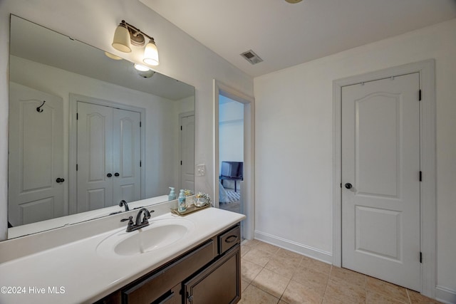 270 Hydrangea Ln, Hampstead, NC 28443 - bathroom with vanity, tile patterned floors, and baseboards