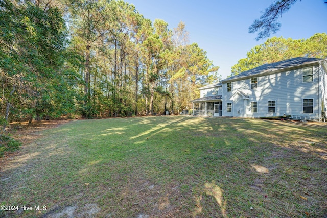 270 Hydrangea Ln, Hampstead, NC 28443 - view of green lawn featuring a sunroom