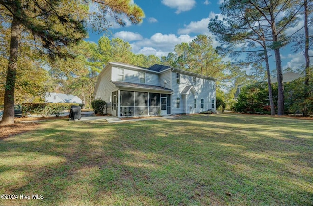 270 Hydrangea Ln, Hampstead, NC 28443 - rear view of property with a sunroom and a lawn
