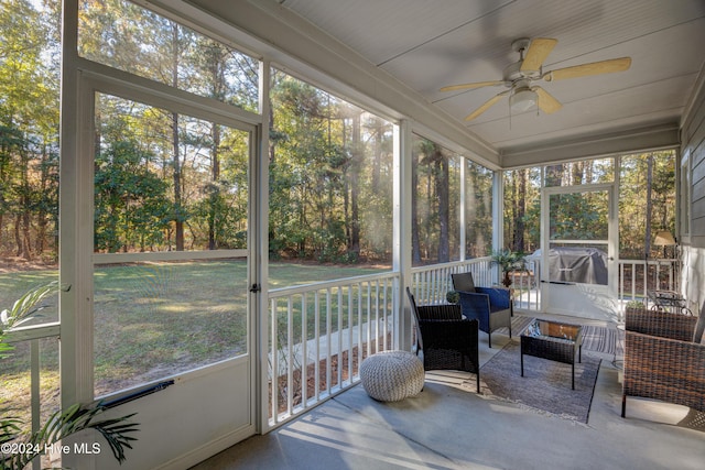270 Hydrangea Ln, Hampstead, NC 28443 - sunroom / solarium featuring a ceiling fan, an outdoor hangout area, and view of scattered trees